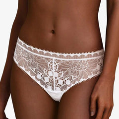 Chantelle Day to Night Tanga Thong in White with refined lace front, hipster fit and soft mesh lining, available at The Foundation.
