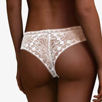 Back view of Chantelle Day to Night Tanga Thong White – sheer lace thong with flattering back cut, stocked by The Foundation.