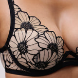 Close-up of floral lace and blush lining on Chantelle Lush Plunge T-Shirt Bra Black/Soft Pink, luxury designer lingerie.