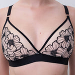 Close-up of Chantelle Pulp Lush Wirefree Triangle Bra, floral lace cups, delicate blush lining, wireless and comfortable.
