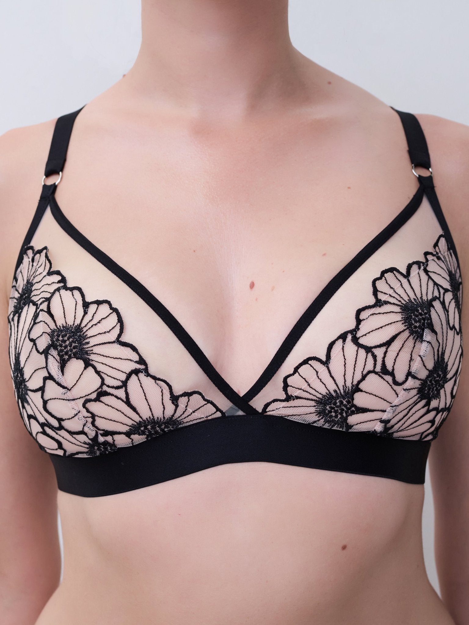 Close-up of Chantelle Pulp Lush Wirefree Triangle Bra, floral lace cups, delicate blush lining, wireless and comfortable.