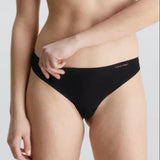 Front view of Calvin Klein Invisibles Thong Black, a seamless microfibre thong with a smooth, invisible fit.
