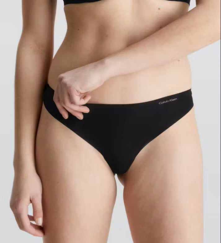 Front view of Calvin Klein Invisibles Thong Black, a seamless microfibre thong with a smooth, invisible fit.