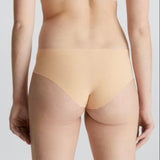 Back view of Calvin Klein Invisibles Hipster Light Caramel, highlighting laser-cut edges for a flawless finish.