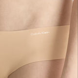 Side view of Calvin Klein Invisibles Hipster Light Caramel, showing soft microfibre fabric and medium rise waist.