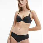 Model wearing Calvin Klein Perfectly Fit T-Shirt Bra Black, a seamless underwire bra with soft moulded cups, adjustable straps, and smooth finish.