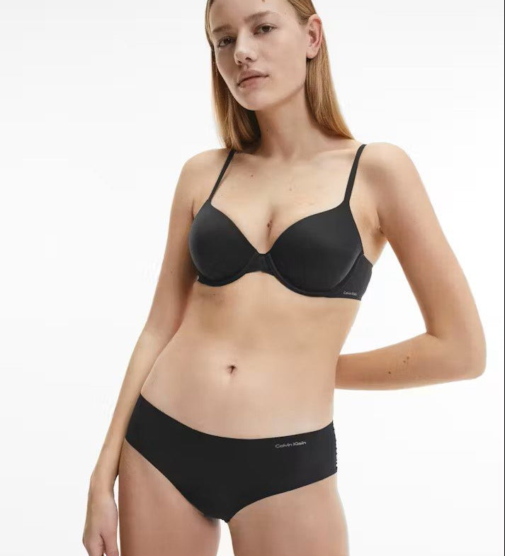 Model wearing Calvin Klein Perfectly Fit T-Shirt Bra Black, a seamless underwire bra with soft moulded cups, adjustable straps, and smooth finish.