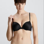 Full front view of Calvin Klein’s Liquid Touch Push Up Plunge Bra in Black—sleek, seamless, and supportive, stocked at The Foundation.