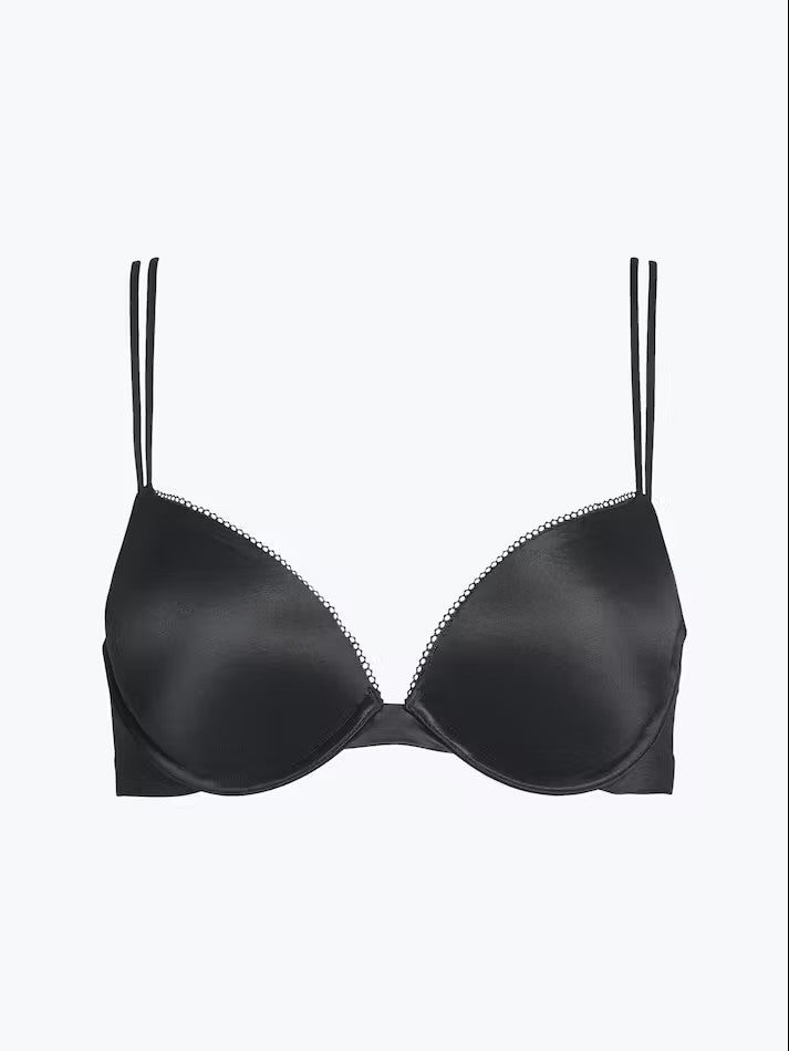 The Foundation’s Calvin Klein Liquid Touch Bra—flat lay showing sculpted cups, lace trim, and supportive plunge silhouette.