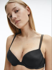 Front view of Calvin Klein’s Liquid Touch Push Up Plunge Bra in Black from The Foundation—plunge neckline with luxe microfibre and lace trim.