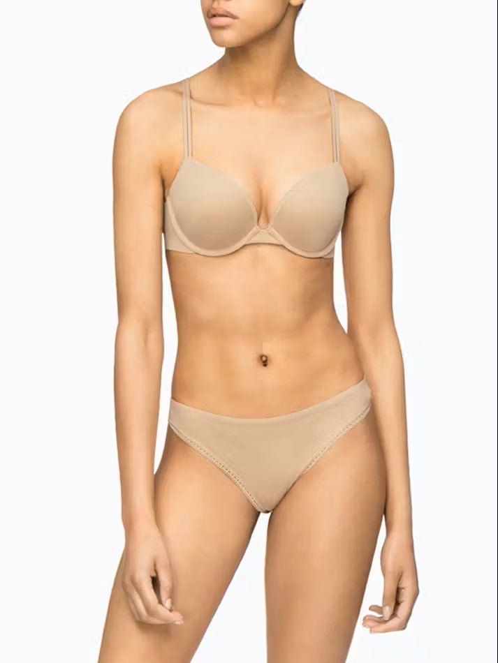 Calvin Klein Bare Push Up Bra featured on model—available at The Foundation, with plunge neckline and adjustable double straps.