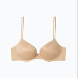 Flat lay of Calvin Klein Liquid Touch Push Up Bra in Bare from The Foundation, showing moulded cups, lace trim, and sleek nude finish.