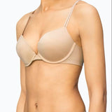 Calvin Klein Liquid Touch Push Up Plunge Bra in Bare, worn by model—available at The Foundation for a seamless lift with lace trim and microfibre fabric.