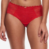 Front view of The Foundation’s Waltz Shorty Brief in Bright Poppy – featuring mid-rise semi-sheer floral lace with scalloped edges for feminine charm.