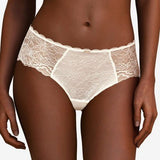 The Foundation's Chantelle Waltz Shorty Brief in Milk – mid-rise ivory lace brief with floral semi-sheer design and flattering scalloped waistband.