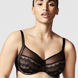 Model wearing the Chantelle Revele Moi 4 Parts Wire Bra in Black, featuring sheer mesh panels, full coverage cups, and supportive underwire design. front view