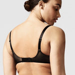 Model wearing the Chantelle Revele Moi 4 Parts Wire Bra in Black, featuring sheer mesh panels, full coverage cups, and supportive underwire design. back view