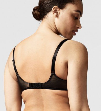 Model wearing the Chantelle Revele Moi 4 Parts Wire Bra in Black, featuring sheer mesh panels, full coverage cups, and supportive underwire design. back view