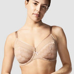 Model showcasing the Chantelle Revele Moi 4 Parts Wire Bra in Nubuck, featuring sheer mesh panels, vertical seams, and full coverage for everyday support. front view