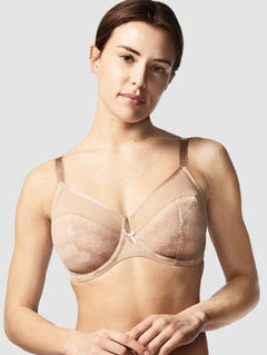 Model showcasing the Chantelle Revele Moi 4 Parts Wire Bra in Nubuck, featuring sheer mesh panels, vertical seams, and full coverage for everyday support. front view