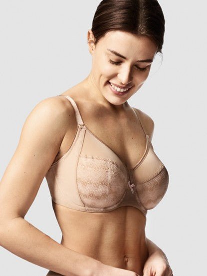 Model showcasing the Chantelle Revele Moi 4 Parts Wire Bra in Nubuck, featuring sheer mesh panels, vertical seams, and full coverage for everyday support. side view