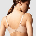 Model showcasing the Chantelle Revele Moi 4 Parts Wire Bra in Nubuck, featuring sheer mesh panels, vertical seams, and full coverage for everyday support. back view
