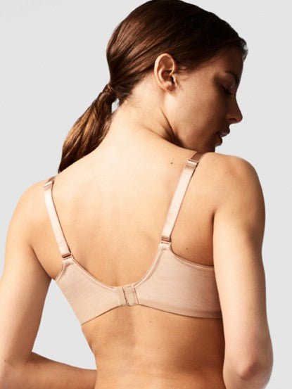 Model showcasing the Chantelle Revele Moi 4 Parts Wire Bra in Nubuck, featuring sheer mesh panels, vertical seams, and full coverage for everyday support. back view