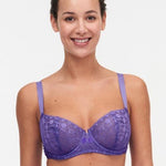 Model wearing Chantelle Day to Night Half Cup Bra in Veronica purple with demi shape, refined Lycra lace, and adjustable straps for a lifted look. front view