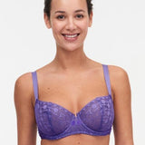 Model wearing Chantelle Day to Night Half Cup Bra in Veronica purple with demi shape, refined Lycra lace, and adjustable straps for a lifted look. front view