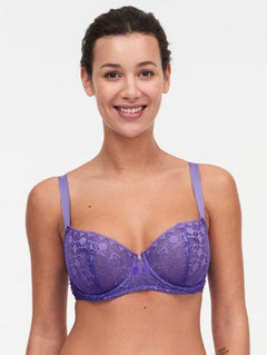 Model wearing Chantelle Day to Night Half Cup Bra in Veronica purple with demi shape, refined Lycra lace, and adjustable straps for a lifted look. front view