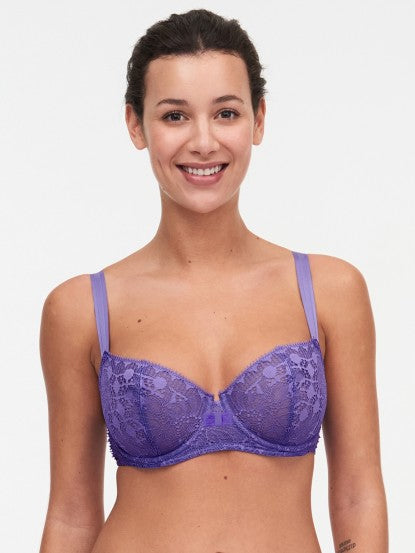 Model wearing Chantelle Day to Night Half Cup Bra in Veronica purple with demi shape, refined Lycra lace, and adjustable straps for a lifted look. front view