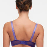Model wearing Chantelle Day to Night Half Cup Bra in Veronica purple with demi shape, refined Lycra lace, and adjustable straps for a lifted look. back view
