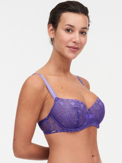 Model wearing Chantelle Day to Night Half Cup Bra in Veronica purple with demi shape, refined Lycra lace, and adjustable straps for a lifted look. side view