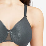 Model wearing the Chantelle C Magnifique Moulded Bra in Slate Grey from The Foundation, featuring full-coverage cups and smoothing back band. close up view
