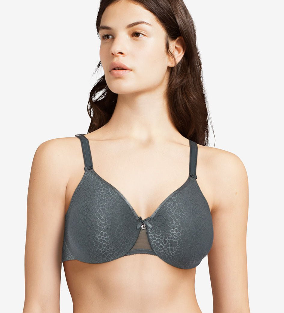 Model wearing the Chantelle C Magnifique Moulded Bra in Slate Grey from The Foundation, featuring full-coverage cups and smoothing back band.