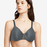 Model wearing the Chantelle C Magnifique Moulded Bra in Slate Grey from The Foundation, featuring full-coverage cups and smoothing back band.