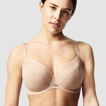 Model in Chantelle Parisian Allure Covering Bra in Nude from The Foundation, showing semi-sheer cups, low plunge, and racerback-friendly straps.