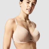 Model in Chantelle Parisian Allure Covering Bra in Nude from The Foundation, showing semi-sheer cups, low plunge, and racerback-friendly straps. side view
