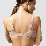 Model in Chantelle Parisian Allure Covering Bra in Nude from The Foundation, showing semi-sheer cups, low plunge, and racerback-friendly straps. back view