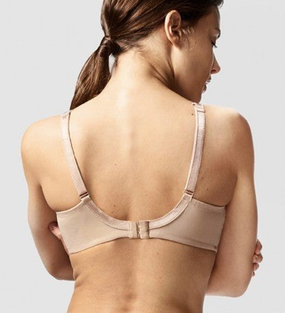 Model in Chantelle Parisian Allure Covering Bra in Nude from The Foundation, showing semi-sheer cups, low plunge, and racerback-friendly straps. back view