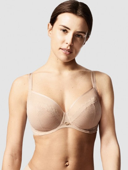 Model in Chantelle Parisian Allure Covering Bra in Nude from The Foundation, showing semi-sheer cups, low plunge, and racerback-friendly straps.