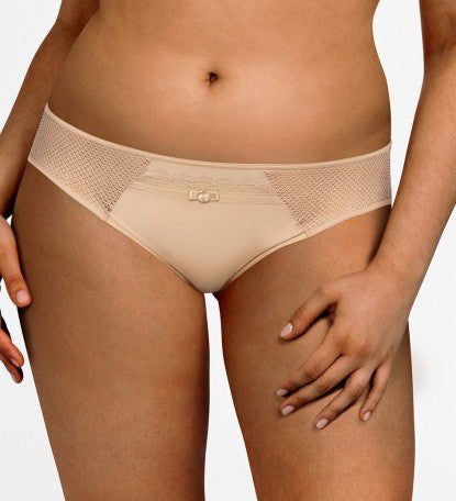 Chantelle Parisian Allure Brief in Nude, showcasing fishnet tulle side inlays and gold charm at the front.
