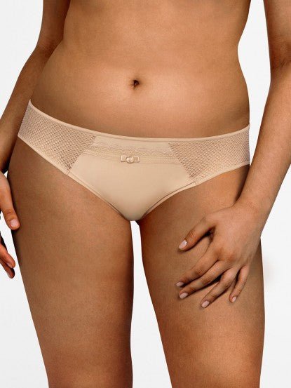Chantelle Parisian Allure Brief in Nude, showcasing fishnet tulle side inlays and gold charm at the front.