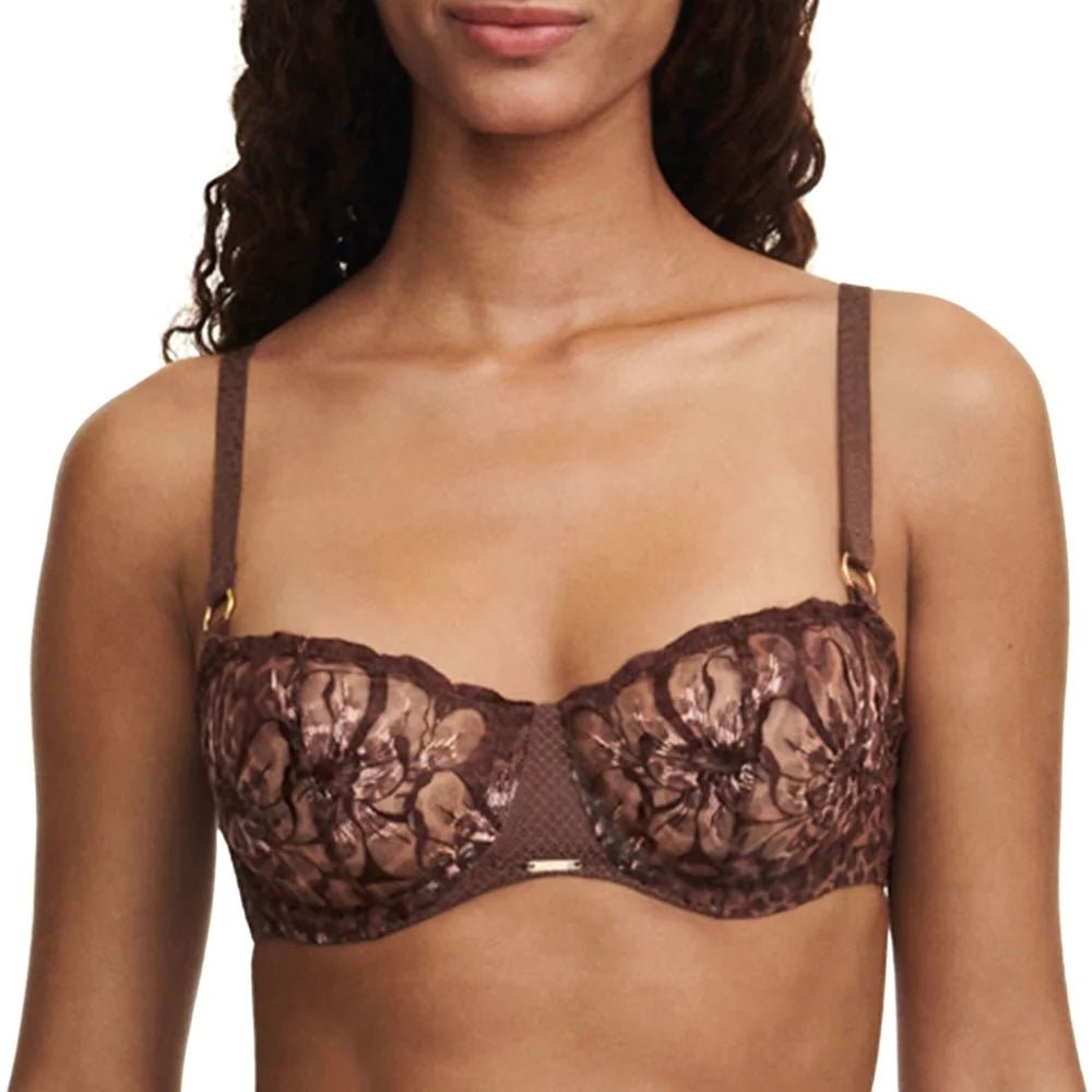 Front view of model in Fleurs Half Cup Balcony Bra Leo Print from The Foundation, highlighting demi neckline and transparent cups