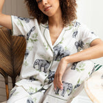 Close-up of the elephant print and sage modal trim on the top, as well as the drawstring detail and fabric texture of the bottoms.