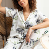 Close-up of the elephant print and sage modal trim on the top, as well as the drawstring detail and fabric texture of the bottoms.