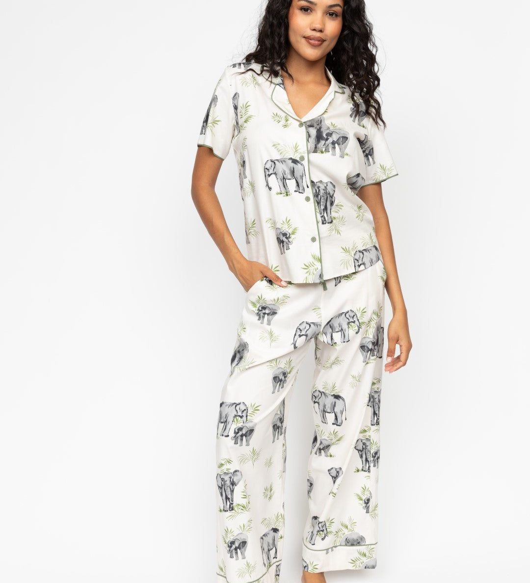Front view of the Cyberjammies Eloise Elephant Print Pyjama Set, showing the sage-green trimmed revere top and wide-leg bottoms with drawstring waist.