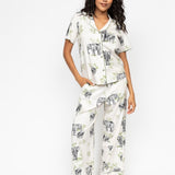 Front view of the Cyberjammies Eloise Elephant Print Pyjama Set, showing the sage-green trimmed revere top and wide-leg bottoms with drawstring waist.