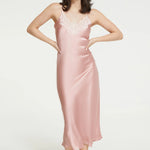Model wearing Ginia Silk Lace Slip in Bridal Rose with delicate lace neckline and soft pink hue.