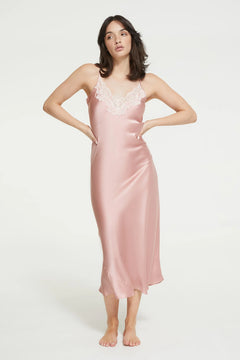 Model wearing Ginia Silk Lace Slip in Bridal Rose with delicate lace neckline and soft pink hue.